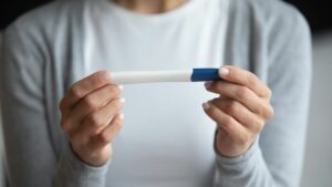 Office Hysteroscopy Can Improve Pregnancy Rates - A woman viewing her pregnancy test